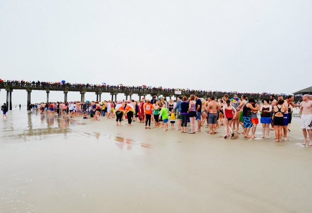 The crowd ready to run into the cold waters for the polar plunge on Tybee Island.